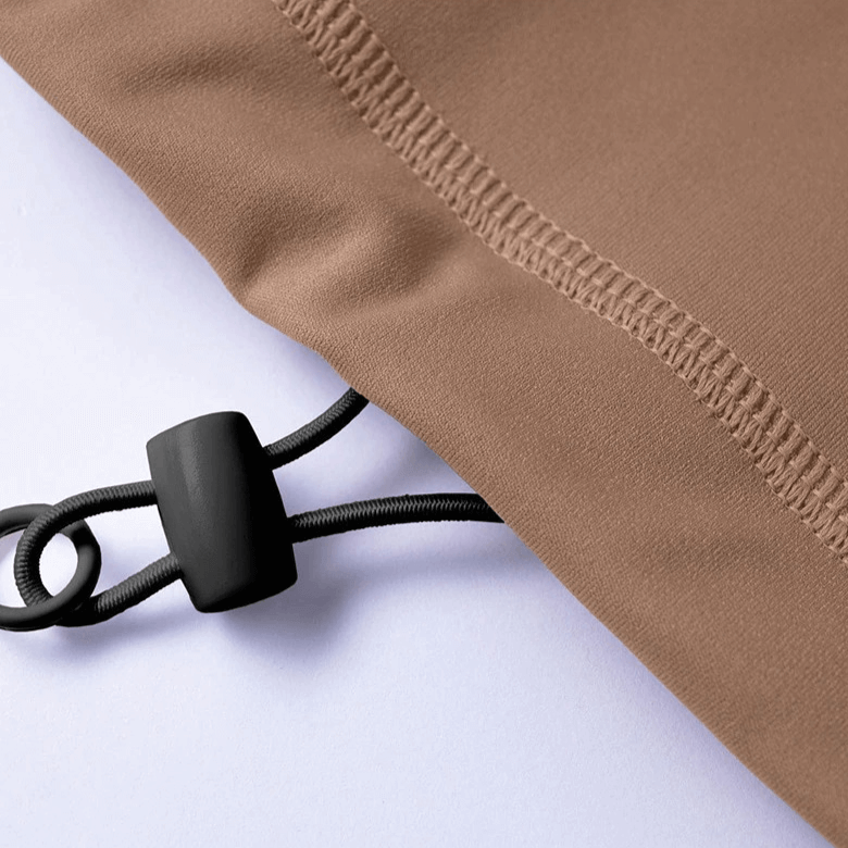 Close-up of a drawstring and seam detail on a brown sports sweatshirt for women, showcasing craftsmanship and design.